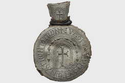 Pilgrimage ampulla with cross and inscription